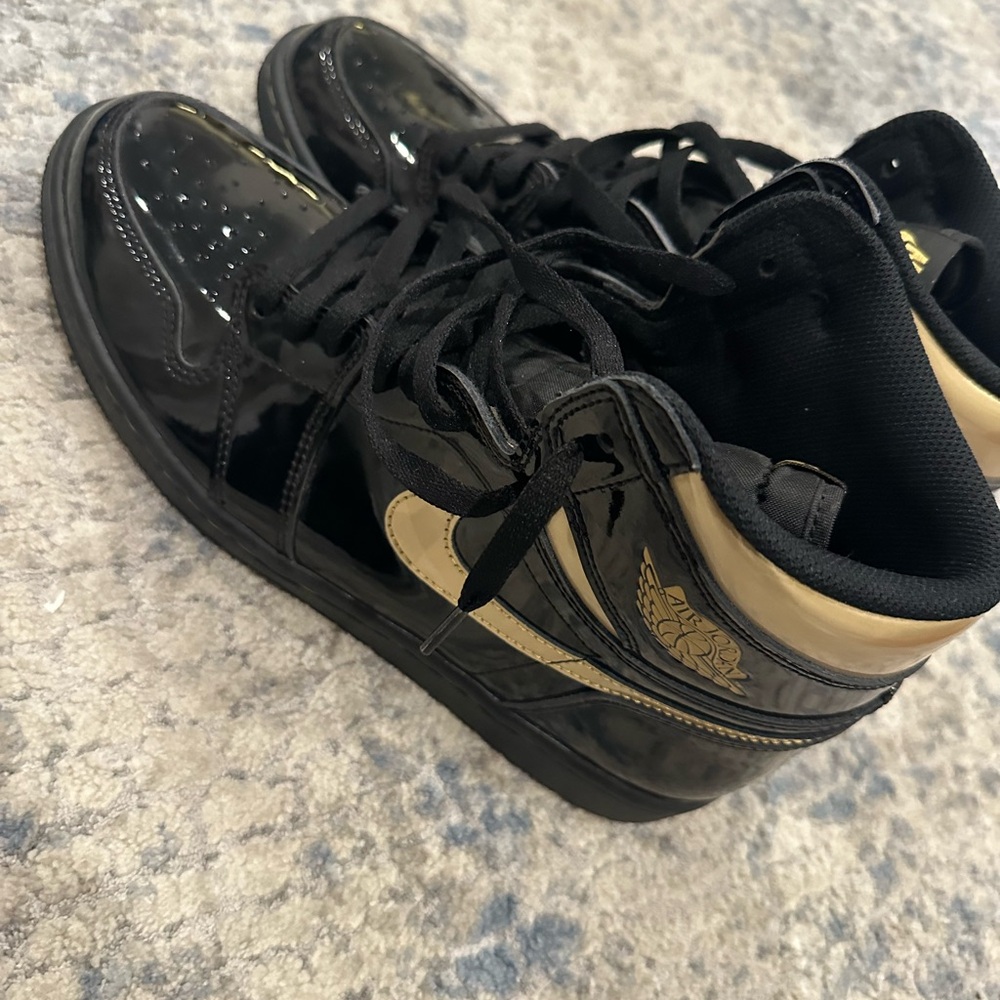 Black and gold patent leather Jordan 1. Worn once great condition. No box